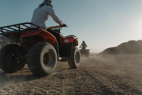 a person on a four wheeler in the desert at InterContinental Mzaar Lebanon Mountain Resort & Spa by IHG in Kfardebian