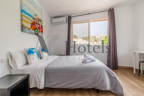 Katil atau katil-katil dalam bilik di AYZ Elcano - Auto check-in property