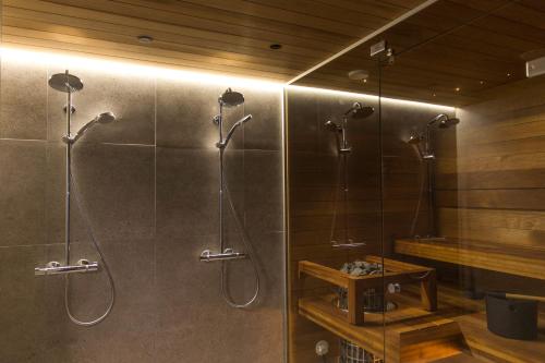 a bathroom with a shower with a glass door at Villa Alveus - Modern Design villa, 3 bdr in Kolari