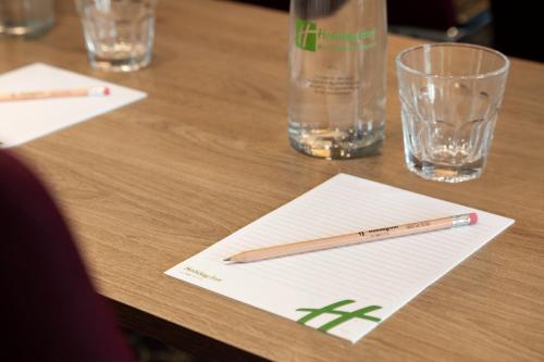 a pencil sitting on top of a wooden table at Holiday Inn Birmingham Airport - NEC by IHG in Bickenhill