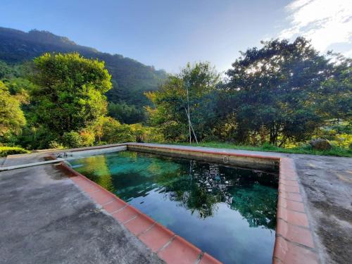a swimming pool on the roof of a house at Casa Yantra La Lola in Pance