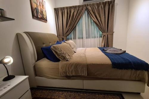 Llit o llits en una habitació de Aldridge Residence Executive Suite 2B@Shah Alam