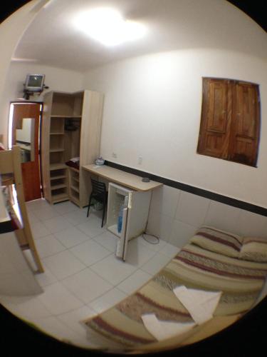 a view of a room with a desk in a room at Hotel Pousada da Praia in Recife