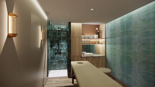a small bathroom with a sink and a shower at Hotel Indigo - Exeter by IHG in Exeter