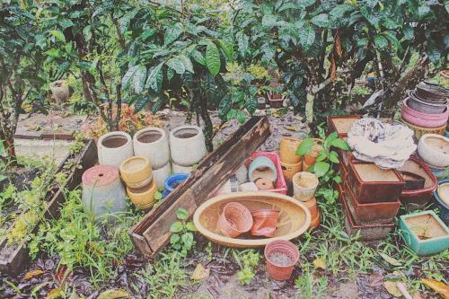 a bunch of pots and pans sitting on the ground at Nấp Đà Lạt in Da Lat