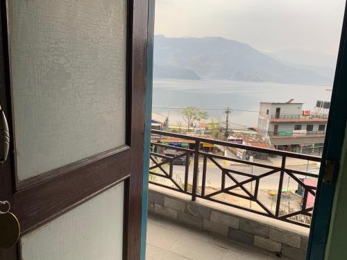 a view of a balcony with a view of the ocean at Lake Vision Guesthouse in Pokhara