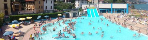 a crowd of people in a large swimming pool at Casa Paradise in Castro