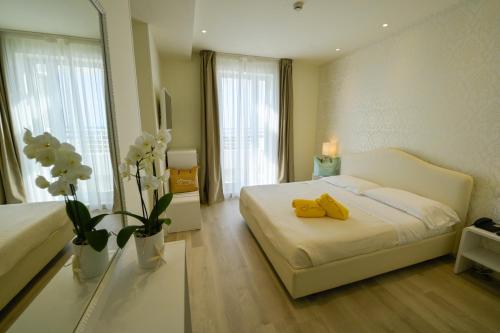 Cama o camas de una habitación en Hotel Aristeo