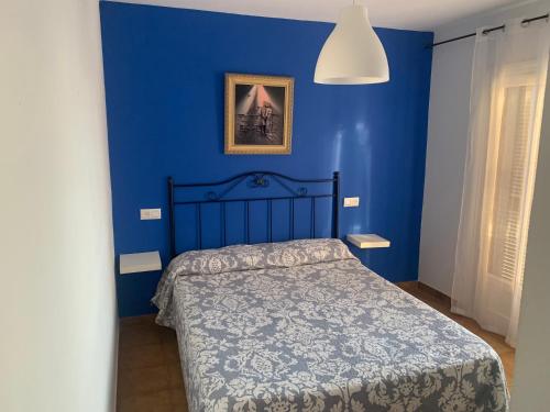 Ένα ή περισσότερα κρεβάτια σε δωμάτιο στο Gran casa con Bonito Jardin
