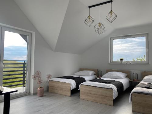 Katil atau katil-katil dalam bilik di Apartamenty Emerald Hills
