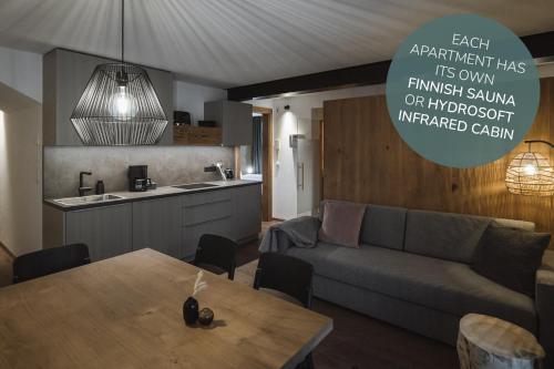 a living room with a couch and a table at Apartments Koflhaus in Cadipietra