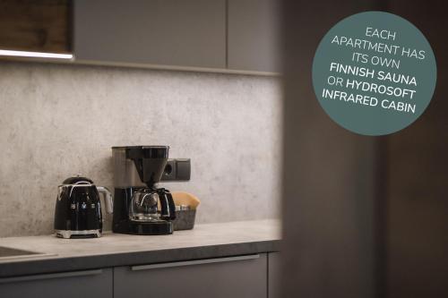 a coffee maker on a counter in a kitchen at Apartments Koflhaus in Cadipietra