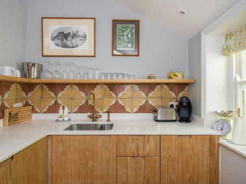 a kitchen with a sink and a counter top at The Nook At Henge Estate in Shrewton
