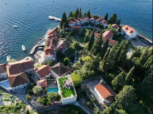 an aerial view of a house on an island in the water at Villa Stella Rose in Lustica