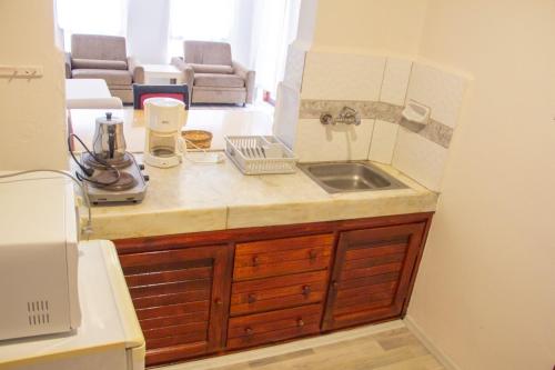 a kitchen with a sink and a counter top at Alanya Luxury apart in Alanya
