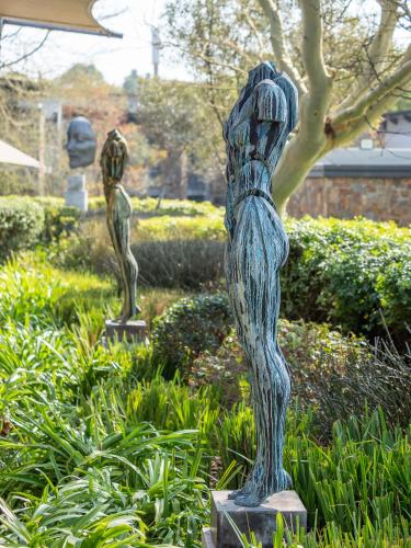 a couple of statues in a garden at Seven Villa Hotel & Spa in Johannesburg
