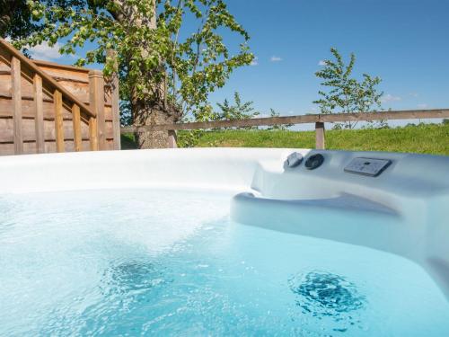 a swimming pool with a boat in the water at Lodge 1 - Silver Birch in Perth