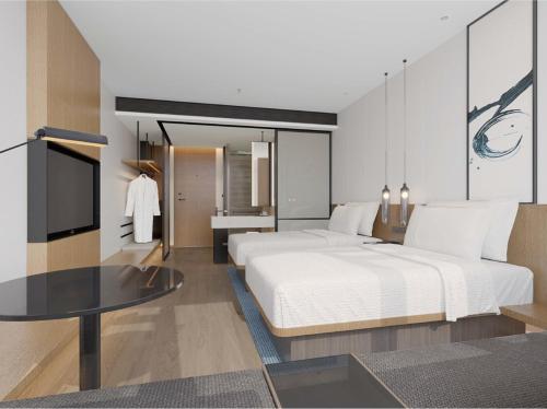 Ένα ή περισσότερα κρεβάτια σε δωμάτιο στο Fairfield by Marriott Liaocheng Dongchangfu