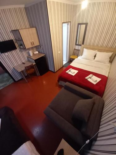 Ένα ή περισσότερα κρεβάτια σε δωμάτιο στο Guest House Anano