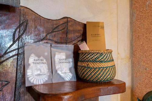 two bags of marshmallows and a basket on a bench at Wag Hill Lodge & Spa in Mwanza