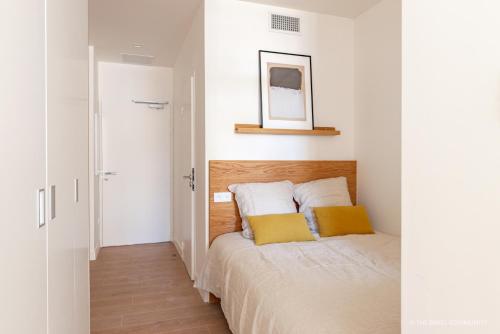 Posteľ alebo postele v izbe v ubytovaní Appartements