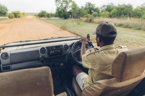 a man sitting in a car taking a picture at Sofala Lodge in Mokopane