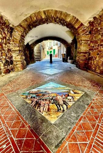 a tile floor with a painting on it in a building at THE PALACE B&B and Apartments in Santo Stefano di Camastra