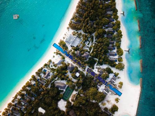 an aerial view of a resort on a beach at Fairmont Maldives, Sirru Fen Fushi in Shaviyani Atoll