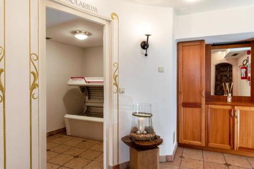 a room with a closet with a mirror and a door at Residence Diana Apartment 301 in Terento