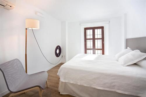 Ένα ή περισσότερα κρεβάτια σε δωμάτιο στο Smart Suites Albaicin