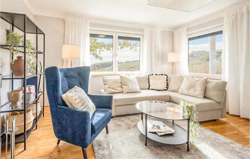 a living room with a couch and chairs and a table at Schoenes Ferienhaus Eisenberg in Eisenberg an der Pinka