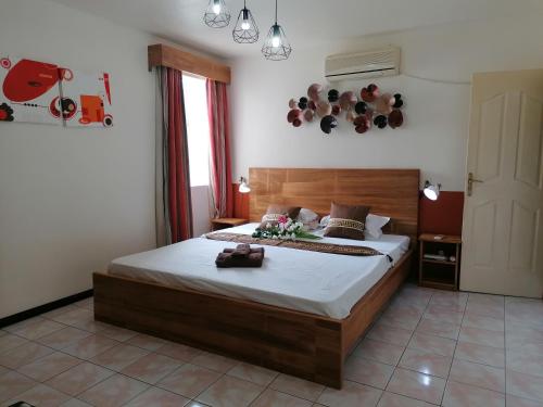 Ένα ή περισσότερα κρεβάτια σε δωμάτιο στο Les Camelias Ground Floor