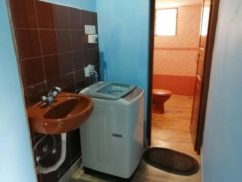 a bathroom with a sink and a toilet at Luxurious 5BHK Peace Villa Siridao Goa Beach in Panaji