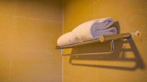a towel on a towel rack in a bathroom at Hijo Resorts Davao in Tagum
