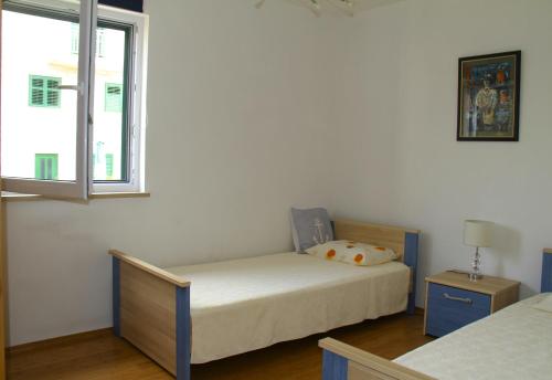 Postel nebo postele na pokoji v ubytování Molo Lozna Apartments