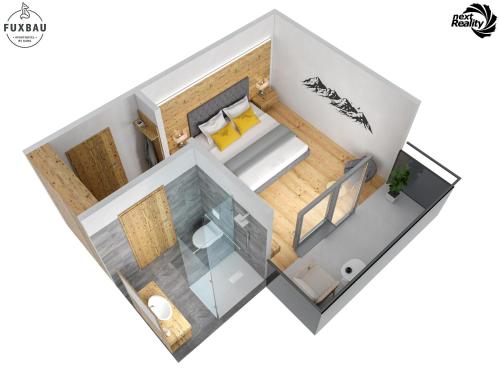 a rendering of a floor plan of a room at Aparthotel Fuxbau in Flachau