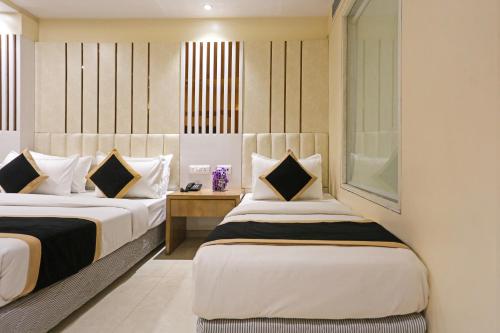 Katil atau katil-katil dalam bilik di Hotel Worth - Near Railway Station
