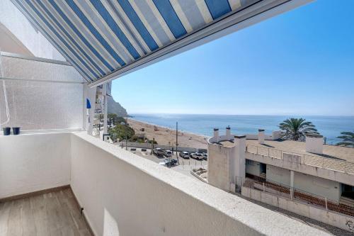 a balcony with a view of the ocean at Casa Atlântico in Sesimbra