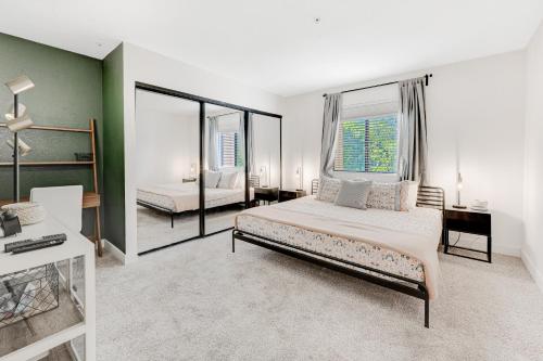 a bedroom with a bed and a large window at Scottsdale Springs in Scottsdale