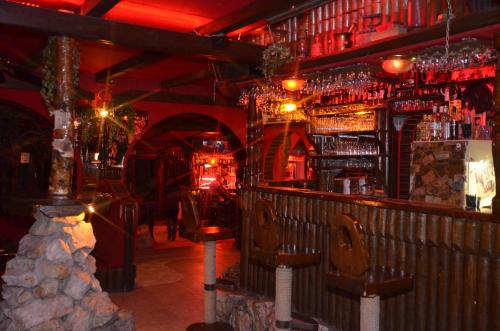 a bar with a lot of bottles of alcohol at Hotel Barbizon in Nyíregyháza