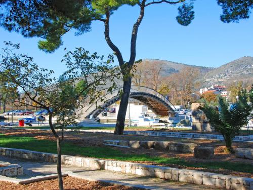 a view of a park with a bridge in the background at Studios Magnolia in Trogir