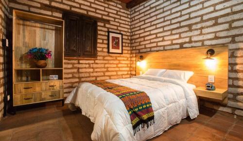Postel nebo postele na pokoji v ubytování Casa Regina Oaxaca