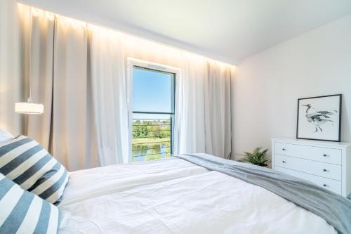 Katil atau katil-katil dalam bilik di Belle View - 3pok, nawet 5 łóżek, piękny widok na rzekę, TV55" z Netflix i Max, parking, winda