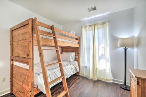 a bedroom with a bunk bed and a ladder at Woodbridge Townhome with Pool Table, Pond Views in Woodbridge