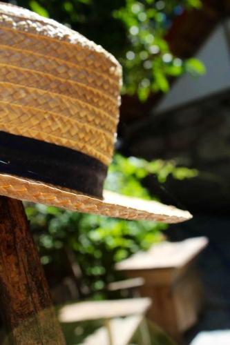 a straw hat sitting on top of a table at Charming Studio in Marco de Canaveses - 25m² with Pool in Marco de Canavezes
