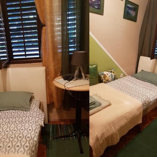 a bedroom with a bed and a table with a lamp at Guest House Cinderella in Herceg-Novi