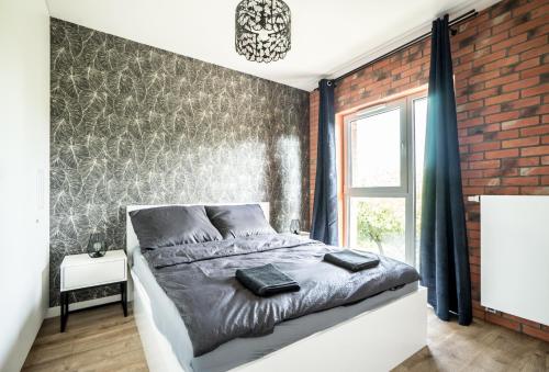 Ένα ή περισσότερα κρεβάτια σε δωμάτιο στο Grand Lux apartment Grodzienska Near to theOldTown