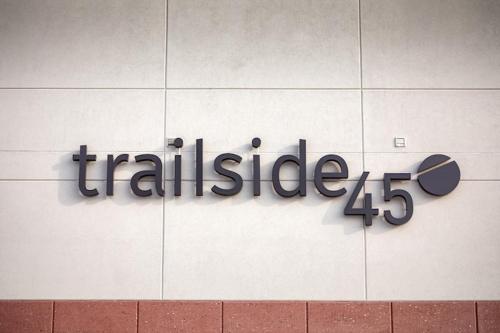 a sign on the side of a building with a skateboard at NEW HAPPY TRAIL 2BR CONDO CLOSE TO DOWNTOWN in Traverse City