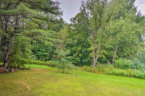 a grassy field with trees in the background at Secluded Getaway Less Than 10 Mi to Saratoga Springs! in South Corinth