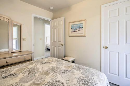 a bedroom with a bed and a dresser and a door at Ocean City Family Getaway about Qtr-Mi to Beach! in Ocean City